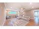 Spacious bonus room with recessed lighting, hardwood floors, comfortable seating, and natural light at 98102 Drummond, Chapel Hill, NC 27517