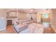 Bright bonus room offers a wet bar with wine cooler, comfortable seating, and hardwood floors at 98102 Drummond, Chapel Hill, NC 27517