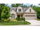 Charming home with a manicured lawn, two-car garage and craftsman curb appeal at 98102 Drummond, Chapel Hill, NC 27517