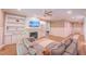 Inviting living room with fireplace, built-in shelves, and comfortable seating perfect for gatherings at 98102 Drummond, Chapel Hill, NC 27517