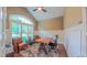 Bright office featuring large window, vaulted ceiling, board and batten walls, and hardwood floors at 98102 Drummond, Chapel Hill, NC 27517