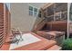 Back deck features a sunken hot tub, an outdoor seating area, and horizontal privacy fence at 1008 Justice Walk Ave, Morrisville, NC 27560