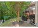 Landscaped backyard with a grill area and seating, perfect for entertaining near lush hydrangeas at 1008 Justice Walk Ave, Morrisville, NC 27560