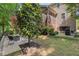 Backyard with a stone paver patio featuring outdoor seating and a grill for outdoor cooking and entertaining at 1008 Justice Walk Ave, Morrisville, NC 27560