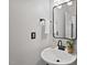 Bathroom vanity features a stylish round sink, black hardware, and modern mirror at 1008 Justice Walk Ave, Morrisville, NC 27560