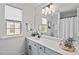 Well-lit bathroom with a large mirror, vanity, and plenty of natural light from the window at 1008 Justice Walk Ave, Morrisville, NC 27560