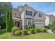 Charming two-story home with landscaped front yard and dark window shutters at 1008 Justice Walk Ave, Morrisville, NC 27560