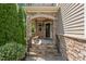 Inviting stone front porch with stone pillars and black metal handrails at 1008 Justice Walk Ave, Morrisville, NC 27560