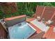 Aerial view of a private hot tub and outdoor seating area surrounded by lush greenery at 1008 Justice Walk Ave, Morrisville, NC 27560