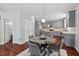 Open-concept kitchen with stainless steel appliances and a dining area for modern living at 1008 Justice Walk Ave, Morrisville, NC 27560