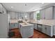 Well-equipped kitchen with stainless steel appliances and a central island for seamless cooking at 1008 Justice Walk Ave, Morrisville, NC 27560