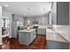 Modern kitchen with stainless steel appliances, granite countertops, and a center island at 1008 Justice Walk Ave, Morrisville, NC 27560