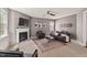The living room features a fireplace and a dark leather sofa at 1008 Justice Walk Ave, Morrisville, NC 27560
