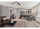 Cozy living room with open floorplan to kitchen and hardwood floors at 1008 Justice Walk Ave, Morrisville, NC 27560