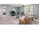 Living room features a window view, comfortable furniture, and stylish decor with hardwood flooring at 1008 Justice Walk Ave, Morrisville, NC 27560