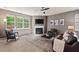 The living room is warm and inviting with a fireplace and plush seating at 1008 Justice Walk Ave, Morrisville, NC 27560