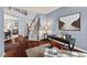 Inviting living room features a staircase, hardwood floors, and a stylish desk area at 1008 Justice Walk Ave, Morrisville, NC 27560