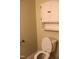 Cozy bathroom featuring a toilet, upper storage and tile flooring at 10180 Buffalo Rd, Clayton, NC 27527