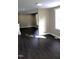 Bright living room with beautiful hardwood flooring, neutral paint and recessed lighting at 10180 Buffalo Rd, Clayton, NC 27527