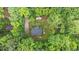 An aerial view of the property and surrounding trees at 1027 Holden Rd, Youngsville, NC 27596