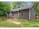 A backyard with a fenced perimeter and a wood exterior of the home at 1027 Holden Rd, Youngsville, NC 27596
