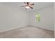 Empty bedroom featuring a ceiling fan, neutral carpet, and a window for natural light at 1027 Holden Rd, Youngsville, NC 27596