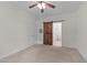 Cozy bedroom with a ceiling fan, neutral carpet, and access to ensuite bathroom at 1027 Holden Rd, Youngsville, NC 27596