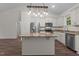 Kitchen with stainless steel appliances, white cabinets, and granite countertops on an island at 1027 Holden Rd, Youngsville, NC 27596
