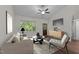 Cozy living room with stylish furnishings, a ceiling fan, and a view of the outdoors at 1027 Holden Rd, Youngsville, NC 27596