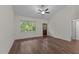 Bright, open living room with a large window and wood-look floors at 1027 Holden Rd, Youngsville, NC 27596