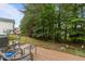 Backyard features a patio and wooded area at 10404 Dapping Dr, Raleigh, NC 27614