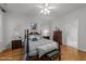 Bedroom with a four-poster bed, ceiling fan, and hardwood floors at 10404 Dapping Dr, Raleigh, NC 27614