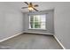 Clean and simple bedroom featuring a ceiling fan, natural light, and neutral paint at 10404 Dapping Dr, Raleigh, NC 27614