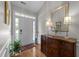 Bright entryway featuring hardwood floors, a decorative mirror and front door views at 10404 Dapping Dr, Raleigh, NC 27614