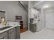 Bright kitchen with modern countertops, stainless appliances, and access to the staircase at 10404 Dapping Dr, Raleigh, NC 27614