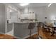 Bright kitchen with breakfast bar and an adjacent dining area at 10404 Dapping Dr, Raleigh, NC 27614