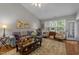 Cozy living room with a neutral color palette and ample natural light at 10404 Dapping Dr, Raleigh, NC 27614