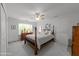 Bedroom featuring a four-poster bed, ceiling fan, and lots of natural light at 10404 Dapping Dr, Raleigh, NC 27614