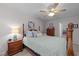 Bedroom featuring a four-poster bed, ceiling fan, and lots of natural light at 10404 Dapping Dr, Raleigh, NC 27614