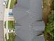 Overhead view of a townhome roof featuring asphalt shingles and well maintained surroundings at 10404 Dapping Dr, Raleigh, NC 27614