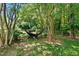Backyard featuring a hammock hanging between two trees and a grassy area at 105 Choyce Ct, Garner, NC 27529