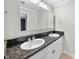 Clean bathroom featuring a double vanity with modern fixtures, sinks and mirror at 105 Choyce Ct, Garner, NC 27529