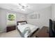 Charming bedroom featuring a full bed, ceiling fan, and plenty of natural light at 105 Choyce Ct, Garner, NC 27529