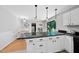 Open-concept kitchen featuring a breakfast bar with pendant lighting and view to dining area and outdoor access at 105 Choyce Ct, Garner, NC 27529