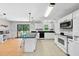 Modern kitchen featuring white cabinets, black countertops and stainless appliances at 105 Choyce Ct, Garner, NC 27529