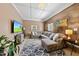 Inviting living room with sectional sofa, stylish rug, and media center, perfect for relaxation at 105 Choyce Ct, Garner, NC 27529