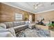Cozy living space with sectional sofa, fitness bike, and natural light, creating a versatile area at 105 Choyce Ct, Garner, NC 27529