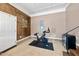 Living space featuring fitness bike, tiled floor, and access to other areas of the home at 105 Choyce Ct, Garner, NC 27529