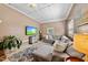 Relaxing living room showcasing a plush sectional sofa, patterned rug, and wall-mounted television at 105 Choyce Ct, Garner, NC 27529