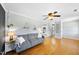 Cozy living room featuring hardwood floors, modern decor, and gray sofa at 105 Choyce Ct, Garner, NC 27529